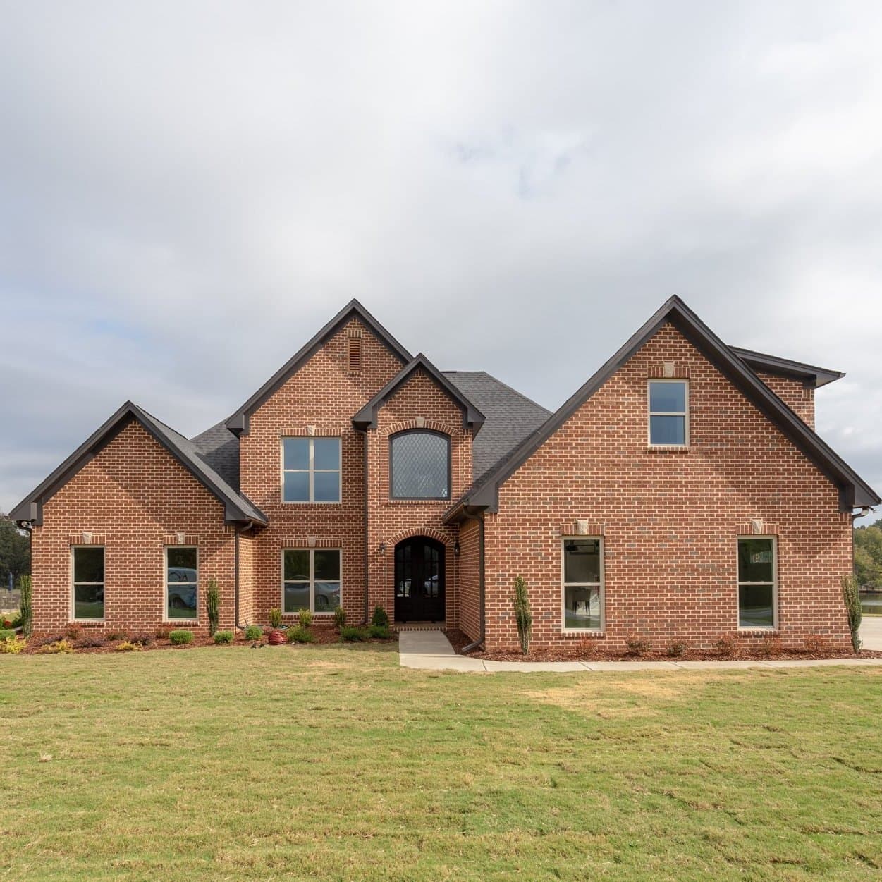 Brick front elevation of a custom Waterstone Homes build in East Alabama