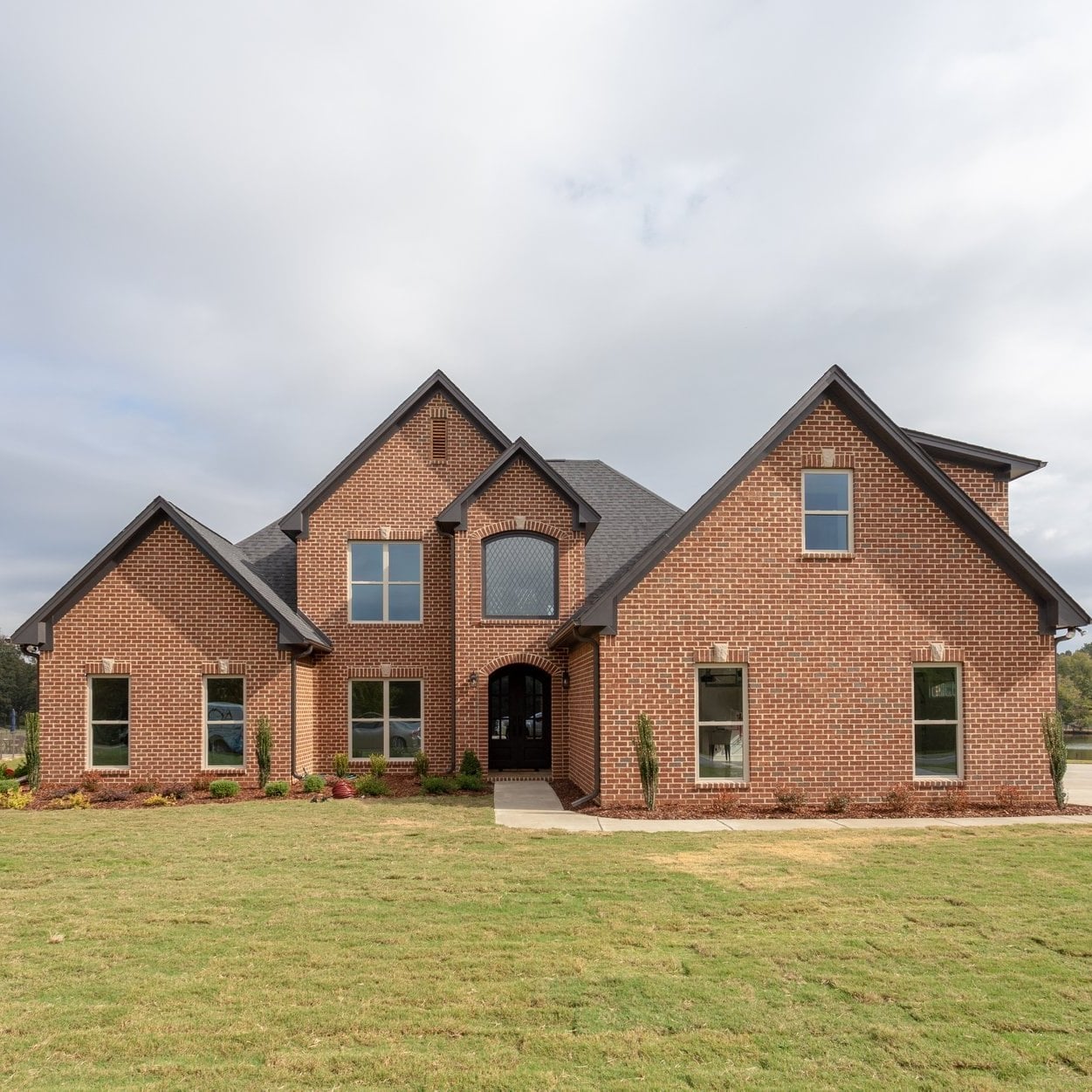 Brick front elevation of a custom Waterstone Homes build in East Alabama