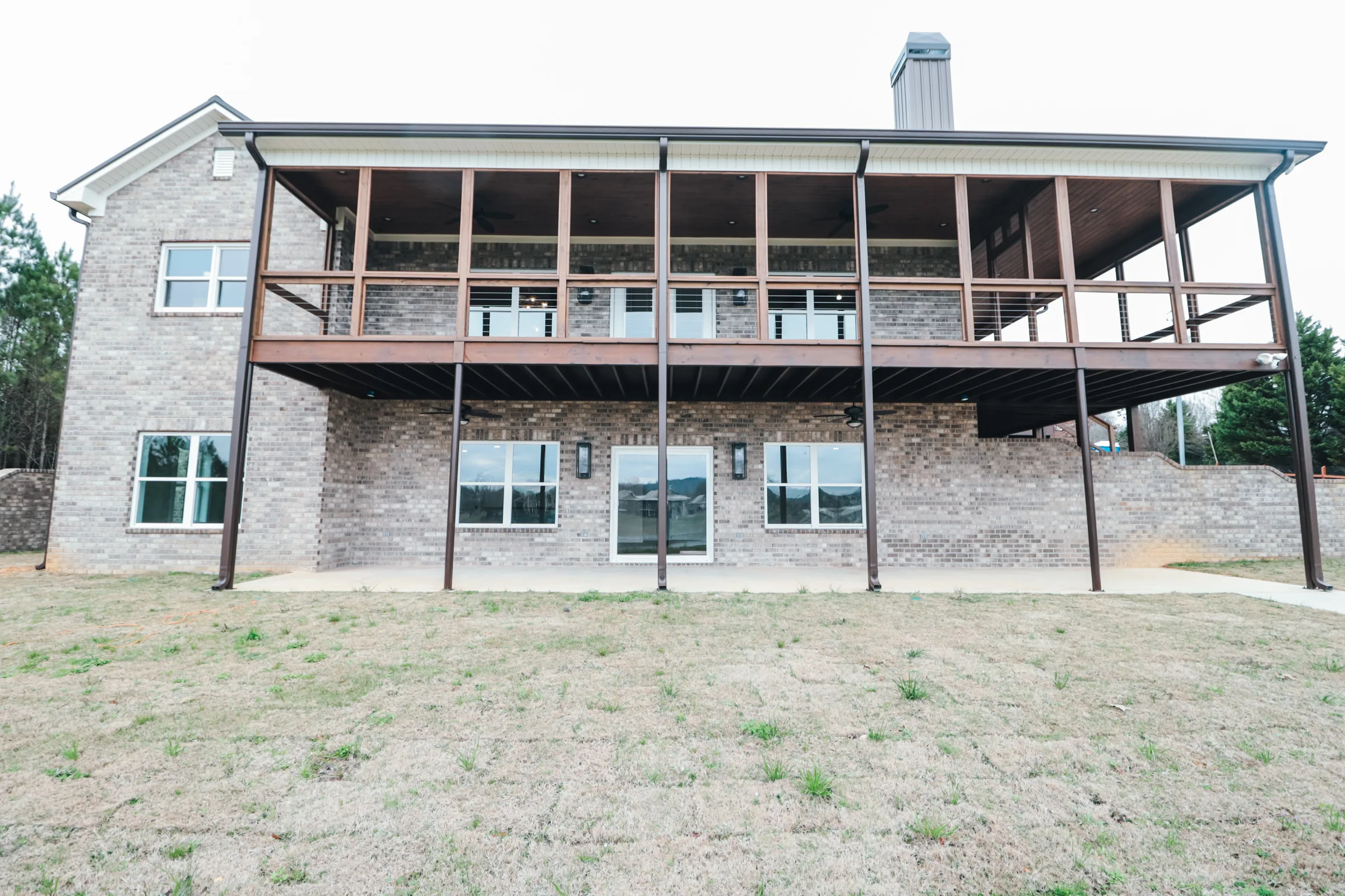 Fence and exterior finish on a custom home lot