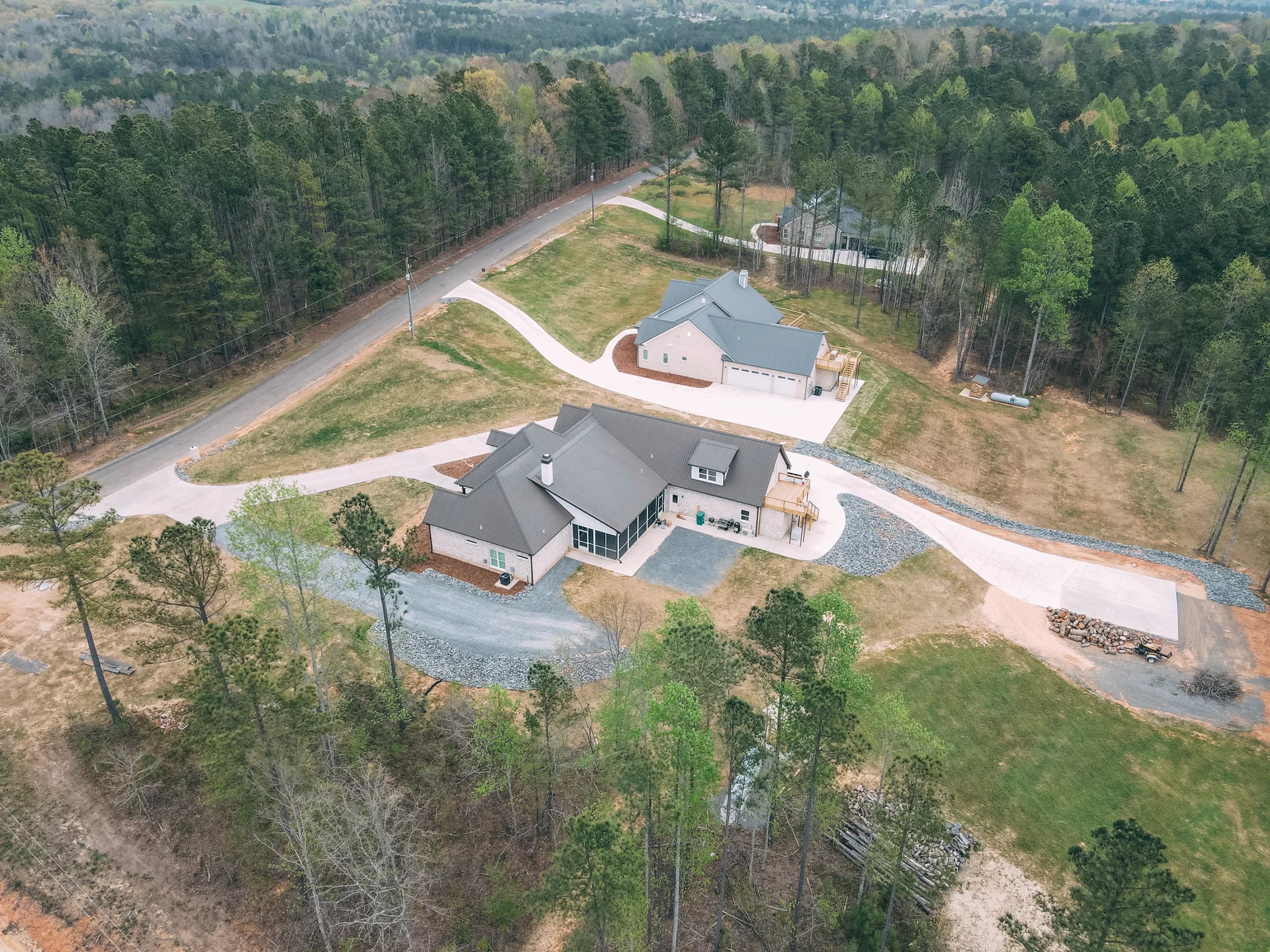 Aerial of a custom home roofline after replacement