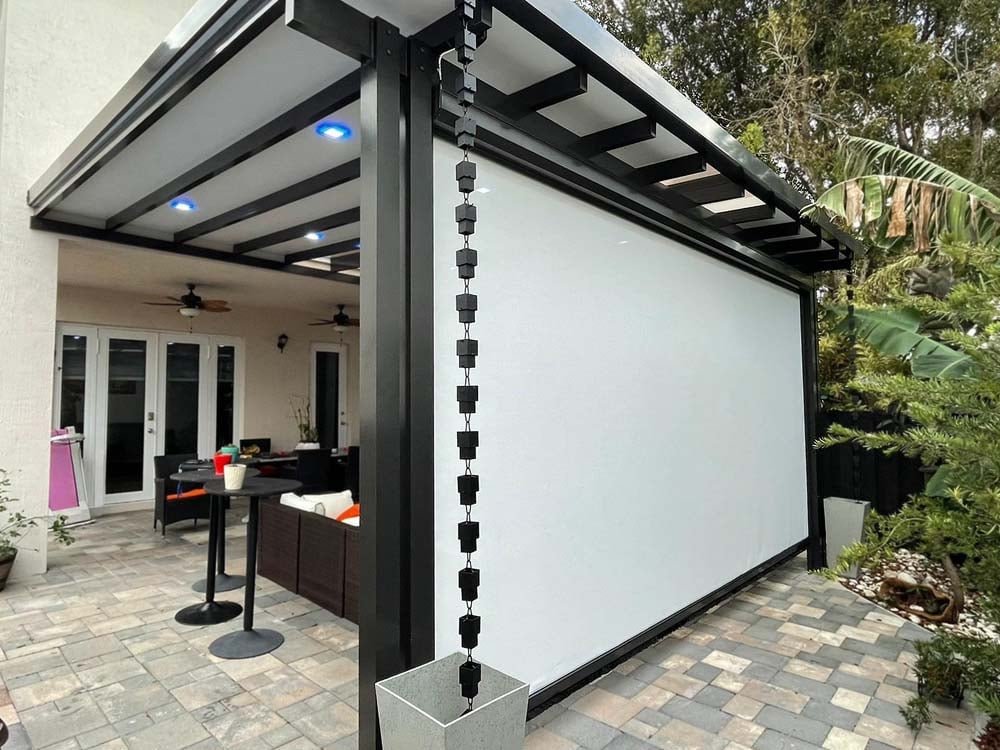 Retractable screen system on a patio cover opening by MaestroShield