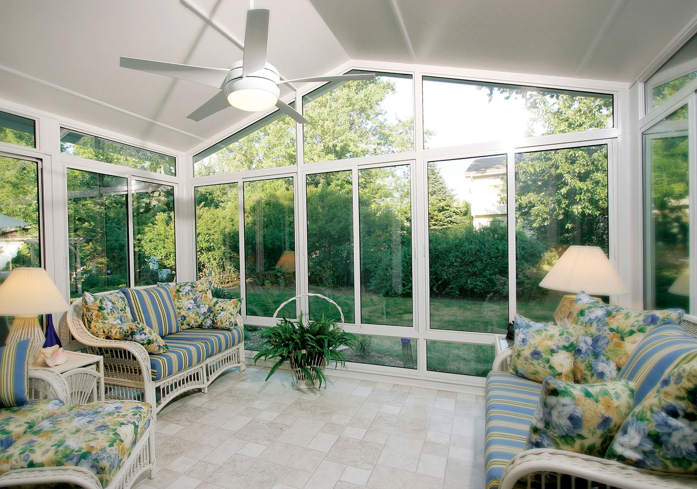 Interior view of a TEMO Cathedral sunroom with vaulted ceiling and white Signa framing over a bright seating area